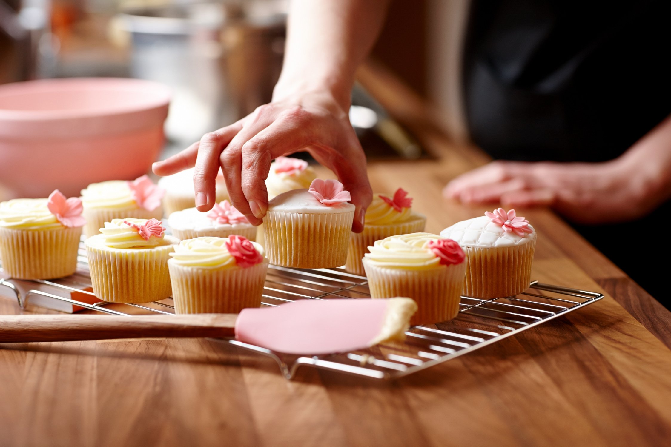 Female baker making cupcakes